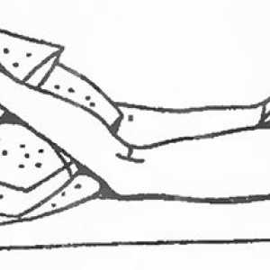 Држењето на телото да се релаксираат напнати мускули за болки во грбот